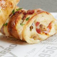 Sausage, Pepperoni and Cheese Stromboli with Bacon Bits · Delicious sausage, pepperoni and cheese stromboli covered with bacon bits.