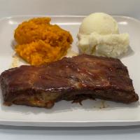 BBQ Pork Ribs Platter · Oven-baked and topped off with homemade bbq sauce. Comes with one piece of pork ribs and two...