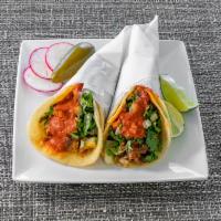 Street Style Taco · Choice of meat, salsa, cilantro, onion, radish.
