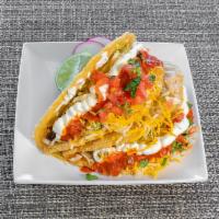 Crunchy Taco · Homemade crunchy tortilla, choice of meat, salsa, cheese, tomato and lettuce.
