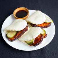 Pork Belly Baos · 3 pieces. Chef Chen's 8-spice braised pork belly 'Gua Bao', with sliced pickled cucumber in ...