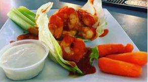 Buffalo Shrimp · Shrimp with Buffalo sauce on a bed of lettuce. Comes with ranch on the side celery and carro...
