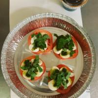Caprese Salad · Slices of fresh mozzarella cheese with olive oil, fresh basil, balsamic reduction on fresh t...