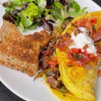 Denver Omelette · Stuffed with Seared Steak, Sausage, Bacon, Jack Cheddar Cheese, Mushrooms, Tomatoes and Onio...