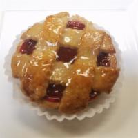 Linzer Tart · Toasted almond crust, filled with almond cream and raspberry.