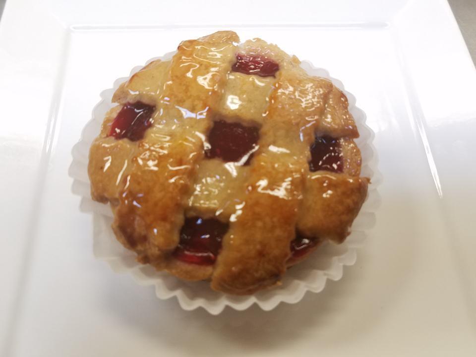 Linzer Tart · Toasted almond crust, filled with almond cream and raspberry.