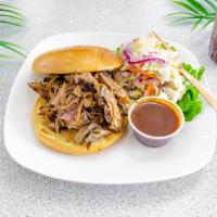 Smoked Pulled Pork Sandwich · Sandwich made from shredded slow cooked meat.