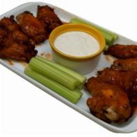 Chicken Wings · 8 pieces. Cooked wing of a chicken coated in sauce or seasoning.
