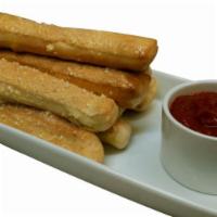 Breadsticks · Includes marinara sauce. Long stick shaped baked bread. 