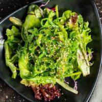 Seaweed Salad  · Sweetly marinated seaweed in Japanese mustard dressing over fresh greens.
