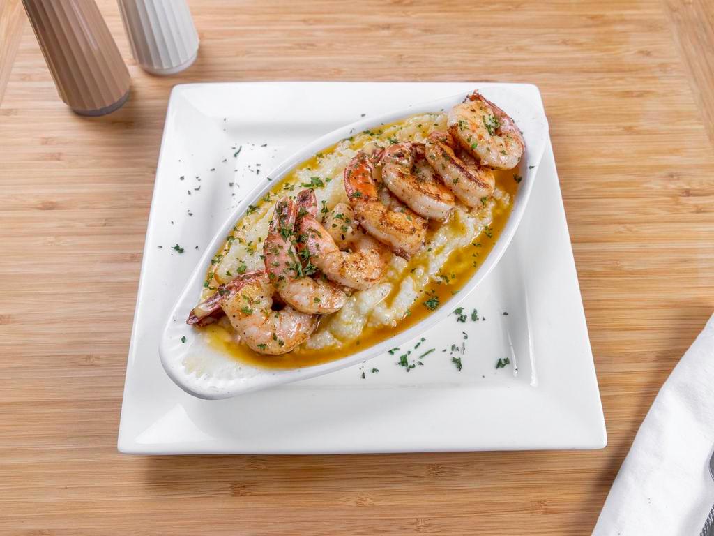 Shrimp and Grits · Fried or sauteed with Cajun creamy sauce over buttery grits.