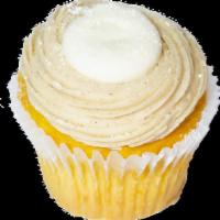 Stuffed French Toast Cupcake · Vanilla cupcake filled with cream cheese icing and topped with a swirl of maple cinnamon but...