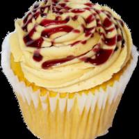 PB&J Cupcake · Vanilla cupcake topped with a layer of raspberry jam, a swirl of peanut butter buttercream a...