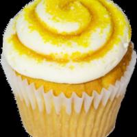 Salty Carmella Cupcake · Vanilla cupcake filled with salted caramel sauce, topped with caramel buttercream, drizzled ...