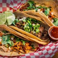 Taco · Corn or flour tortilla. Choice of meat, fish, or vegetarian. Served with cilantro, onions, l...
