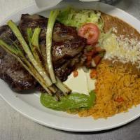 Carne Asada Plate · Rice, beans, pico de gallo, guacamole, sour cream, lettuce and tortillas.

