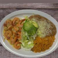 Camarones Al Mojo De Ajo · Sauteed shrimp in garlic and mild red sauce plate, rice beans and salad and tortillas