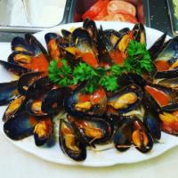 Mussels Fra Diavolo   · Served with over linguine.