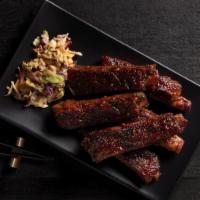 BBQ Pork Spare Ribs · Slow-braised pork ribs wok-seared with a tangy Asian barbecue sauce
