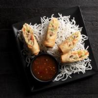 Vegetable Spring Rolls | 2 Count · Crispy rolls stuffed with julienned veggies and sweet chili dipping sauce.
