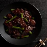 Mongolian Beef · Sweet soy glaze, flank steak, garlic, snipped green onion