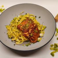 Salmon Pasta  · Fettuccine pasta with salmon fillet, basil garlic olive oil and scallions.