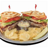 Classic Club · Roast beef, turkey, bacon, pepper jack cheese, provolone, lettuce and tomato on toasted sour...