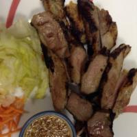 38. Thai BBQ Pork Spare Ribs with Cucumber Salad · Marinated country-style BBQ ribs with garlic sauce.