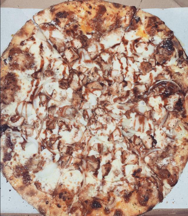 BBQ Chicken Pizza · BBQ sauce base, mozzarella topped with chicken, onions, and tomatoes.