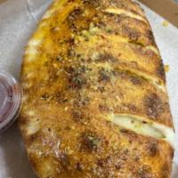 Cheese Calzone · Create your own. Calzone stuffed with mozzarella, ricotta, Parmesan, and your choice of topp...