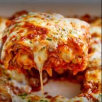Veggie Lasagna · Ricotta, pizza sauce, green peppers, mushrooms, onions, and mozzarella cheese.