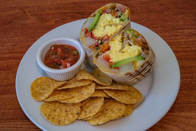 Traditional Breakfast Burrito · Scrambled eggs, breakfast potatoes, pico de gallo, cheddar and choice of meat or avocado. Served with chips and salsa.
