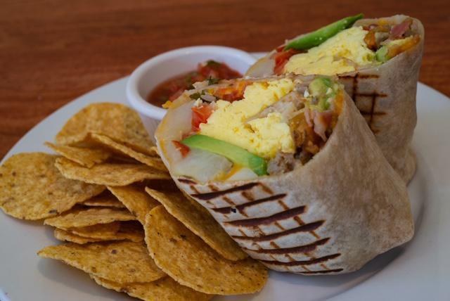 Everybody's Favorite Burrito · Scrambled eggs, breakfast potatoes, pico de gallo, cheddar, pork sausage, bacon and avocado. Served with chips and salsa.