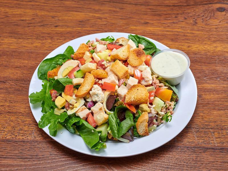 Cobb Salad · Mixed greens, chicken, bacon, blue cheese crumbles, hard-boiled egg, tomatoes, cucumbers and croutons.