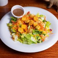 Harvest Salad · Romaine lettuce, carrots, cucumbers, tomatoes, onions, cheddar cheese and croutons.