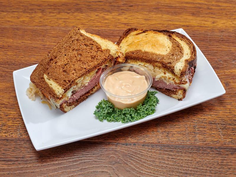 Pastrami Reuben on Rye  · Toasted sliced rye, hot pastrami and melted Swiss cheese topped with 1000 Island dressing and sauerkraut.