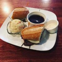 Traditional French Dip Sandwich · Roast beef, herb-buttered roll and au jus.