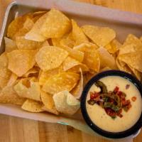 Queso Fundido · Homemade Queso, Roasted Green Peppers, Tomatoes & Red Onions. Served With House Fried Tortil...