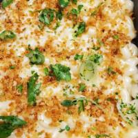 Mac n Cheese · Elbow macaroni cooked with sharp cheddar cheese sauce.  Topped with parmesan and parsley.