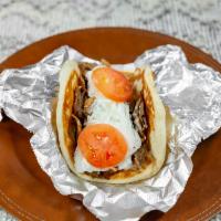 Gyros · Gyro meat sliced off the cone on 7 inch grilled pita bread whith onions ,tomatoes and house ...