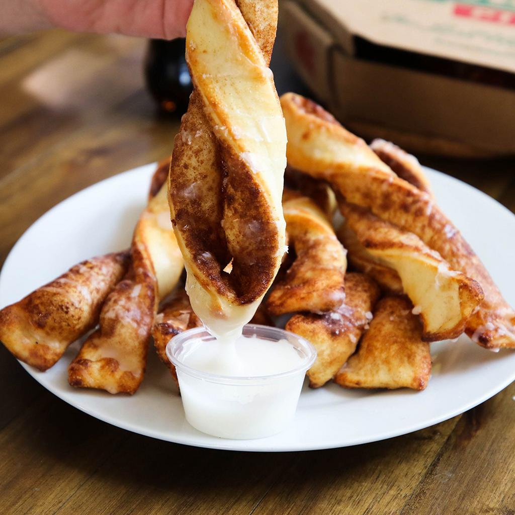 Cinnamon Twists · Our famous twists, rolled in a brown and white sugar cinnamon mixture and topped with a delicious powdered sugar glaze.