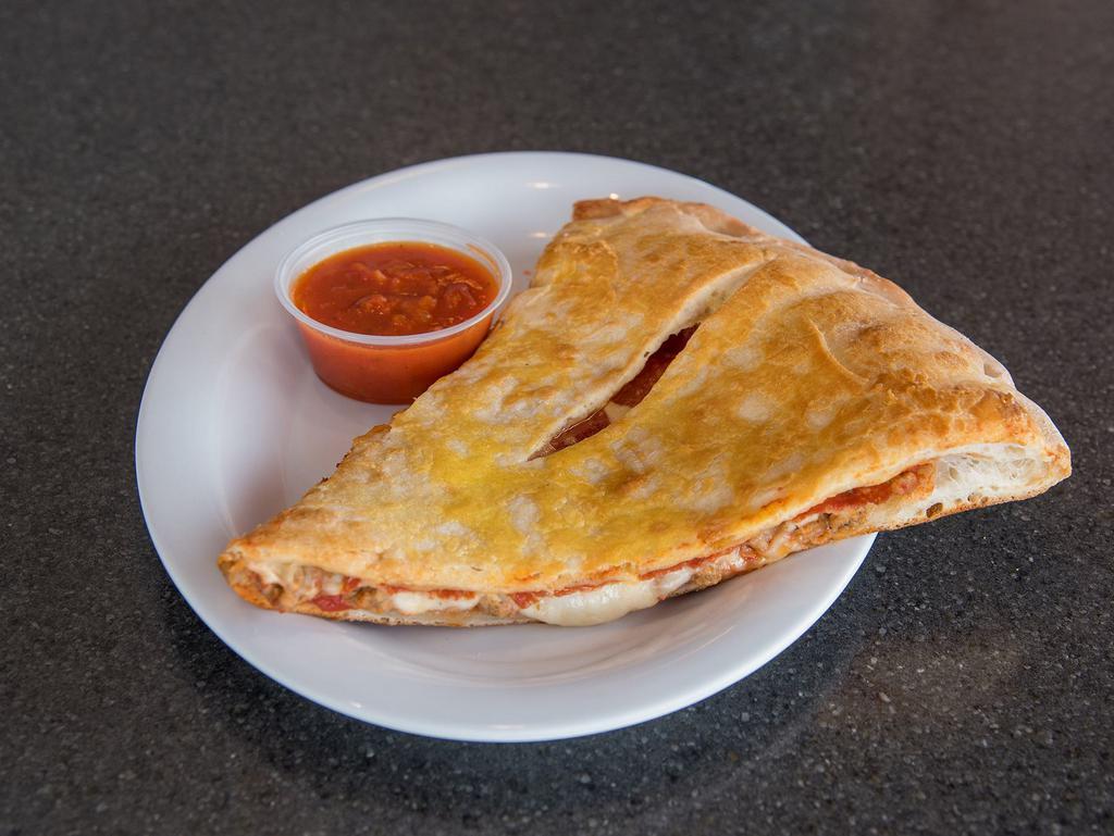Meat Stuffed Slice Pizza · The meat and cheese is stuffed between the layers of pizza crust.