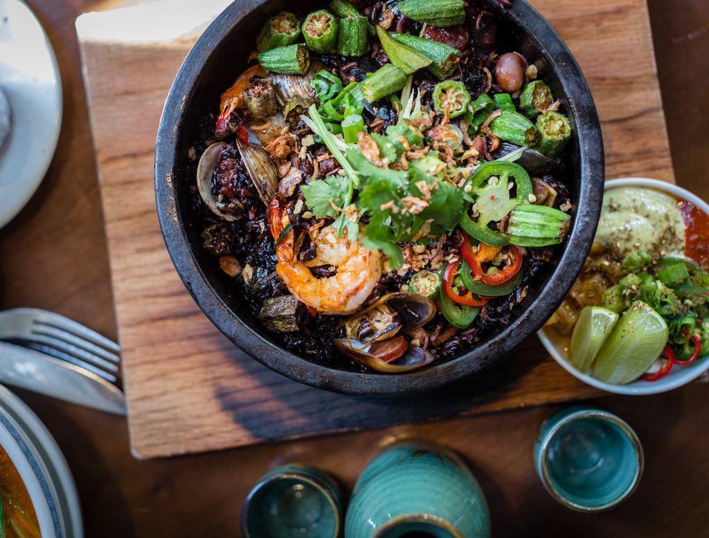 Black Rice · Mussels, shrimp, octopus, scallop, sausage, confit pork, lime leaf aioli and okra.
