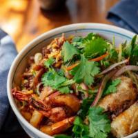 Tom Rang Thit Ba Chi · Caramelized prawns, pork spareribs and tamarind in claypot. 
