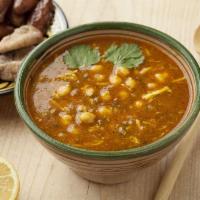 Harira · Traditional Moroccan soup ​made of tomatoes, chicken, fresh herbs and spices.  A house favor...