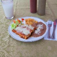 Enchilada Dinner · 3 enchiladas. Choice of filling. Served with rice and beans, cheese and sour cream. Includes...
