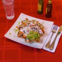 Lengua Taco Salad · Served with lettuce, tomato, sour cream, cheese and guacamole. 