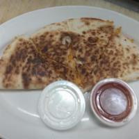 Chicken Quesadilla · Grilled Chicken and Cheese with sour cream and salsa on the side
