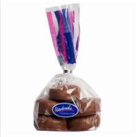 Hand-Dipped Chocolate Jag Paws 6 oz. Bag · Enjoy 6 oz. of bite-sized pecan caramels enrobed in peterbrooke's creamy milk or dark chocol...