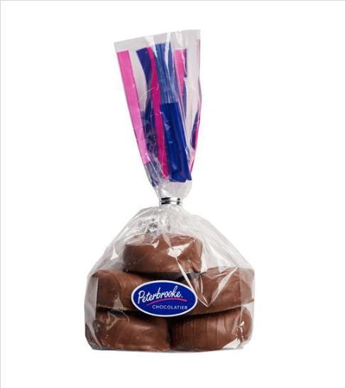 Hand-Dipped Chocolate Jag Paws 6 oz. Bag · Enjoy 6 oz. of bite-sized pecan caramels enrobed in peterbrooke's creamy milk or dark chocolate. These paws are made with lightly salted, roasted pecans and homemade caramel.